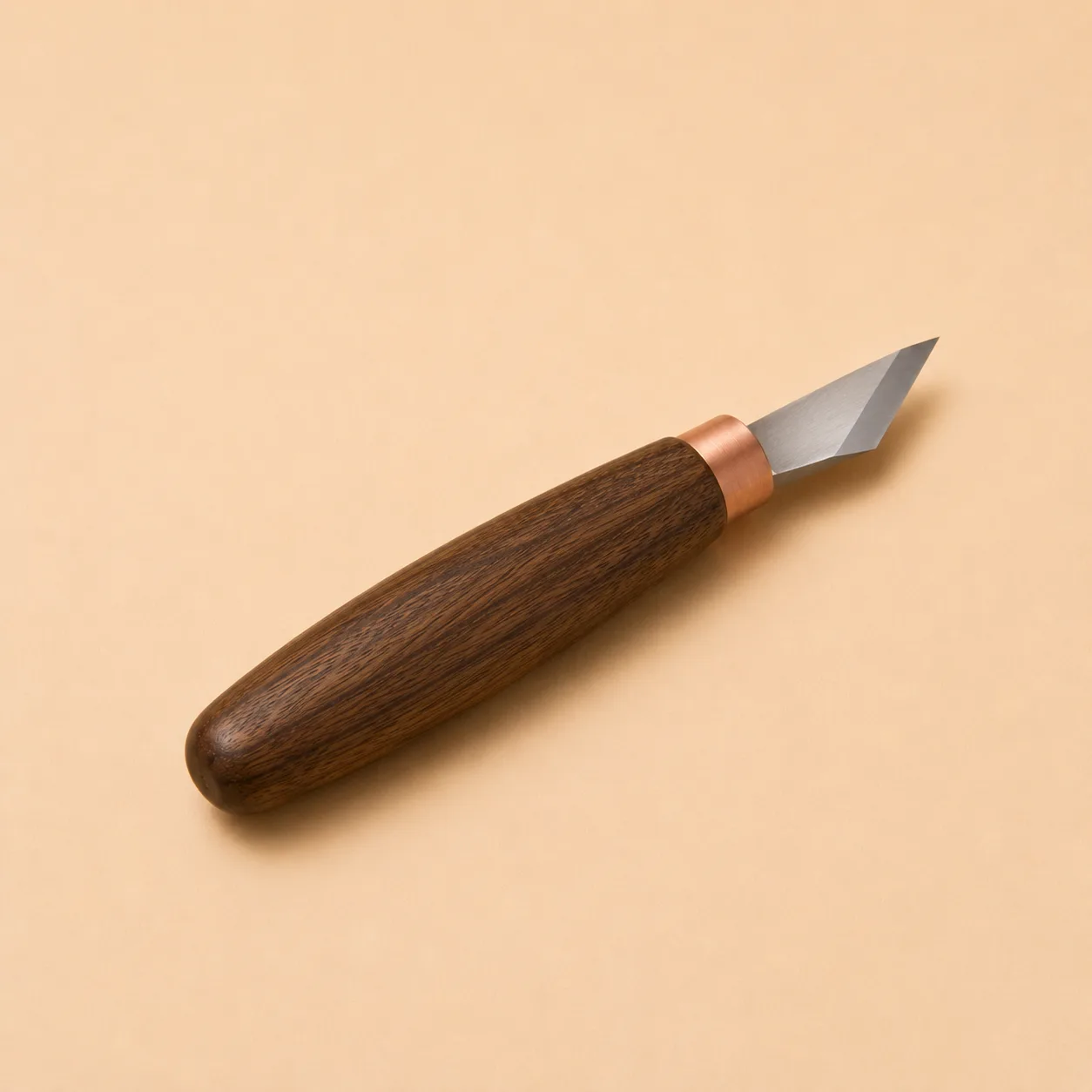 The oblique knife photographed alone, its angled skew-ground blade set on a square walnut handle